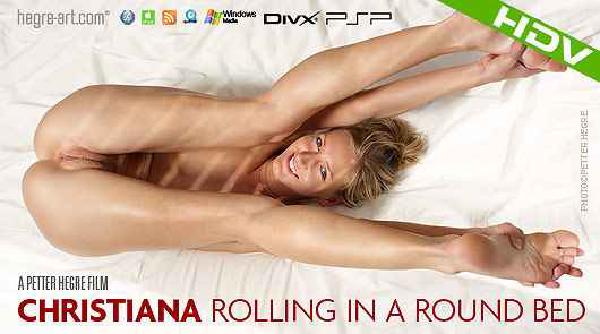 Christiana Rolling in a Round Bed